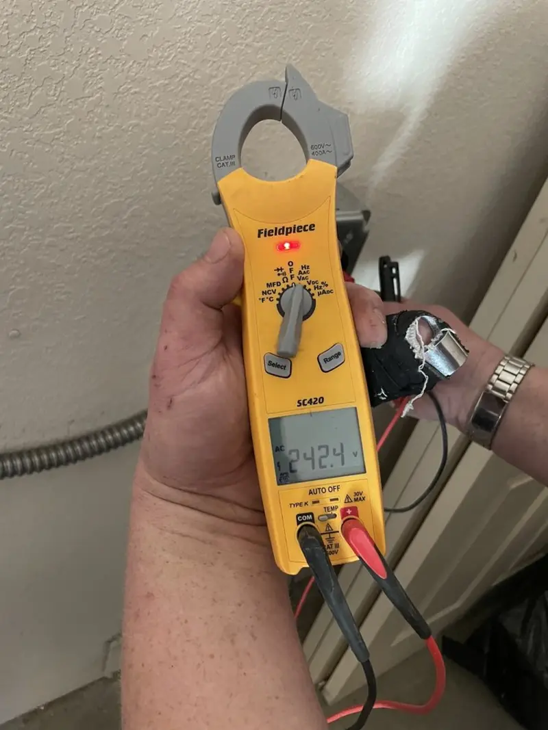 Voltage testing with clamp meter during Outlet Installation in Oaklyn